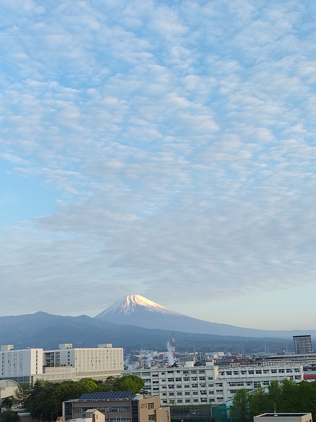 Mount Fuji at dawn above the city